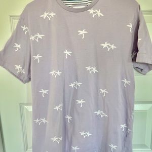 Soft lavender t-shirt brand is Denim & Flowers by Ricky Singh